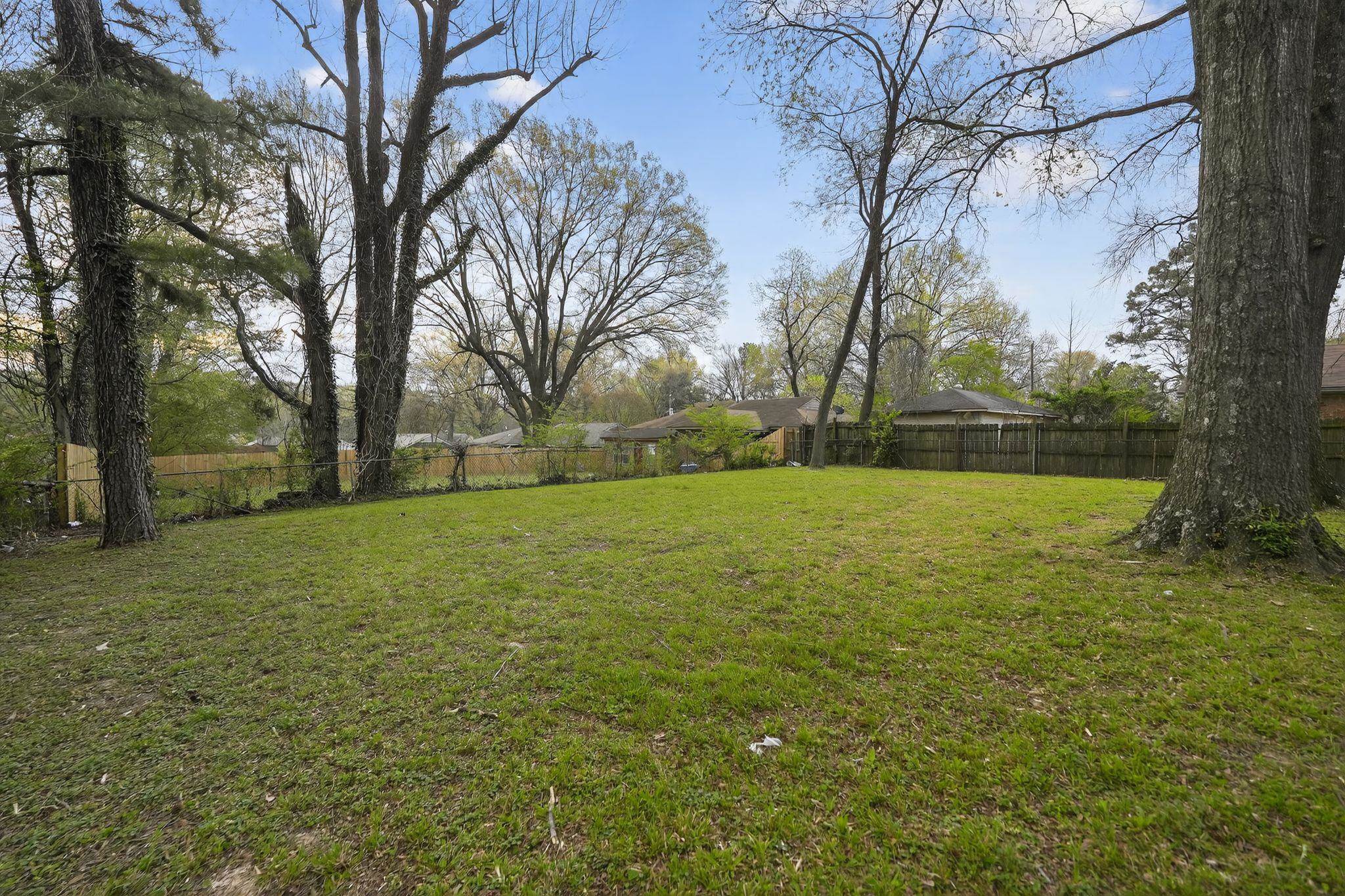 3150 Parham Street Memphis, TN 38127 - Photo 9 of 33 a view of outdoor space with deck area and trees around