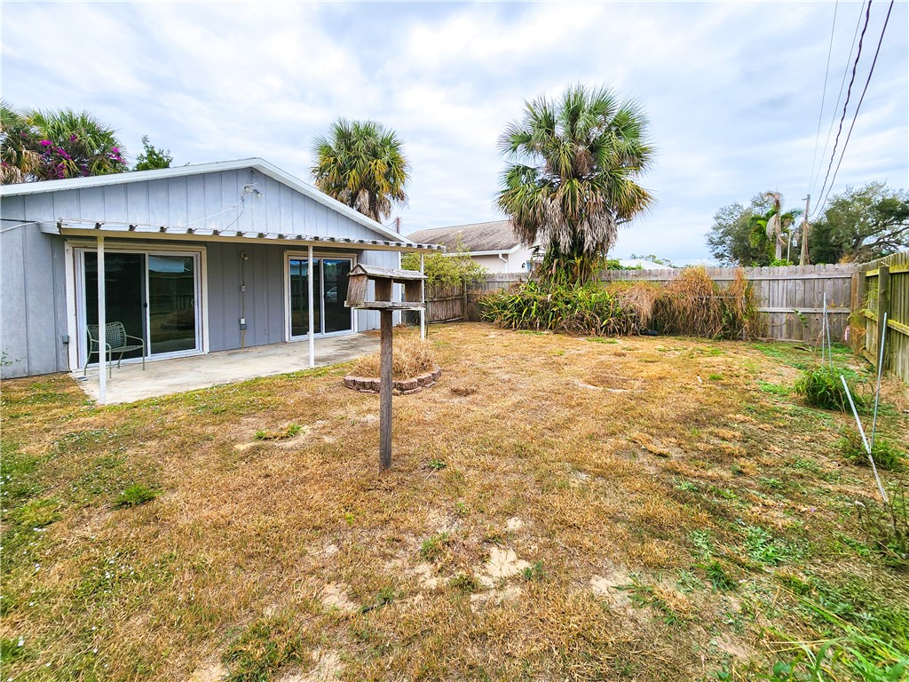 233 13th Street Southwest Vero Beach, FL 32962 - Photo 16 of 20 a front view of a house with a yard
