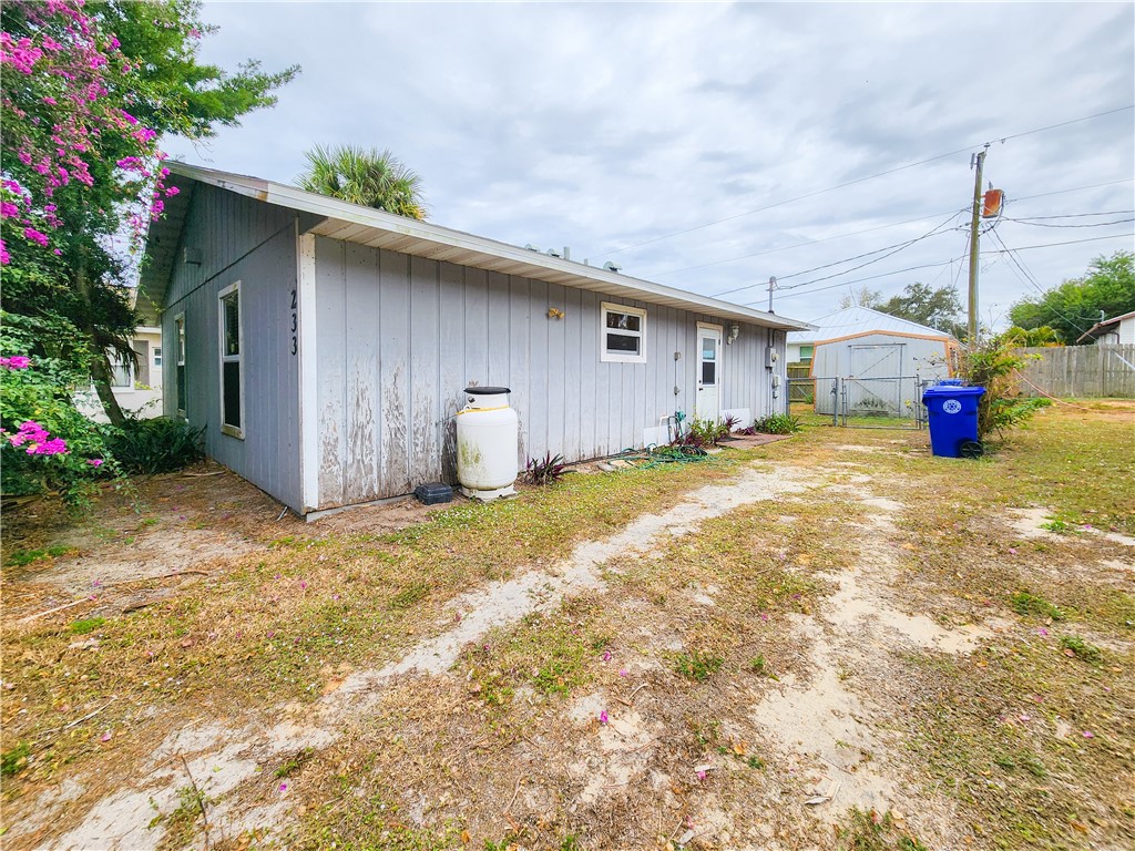 233 13th Street Southwest Vero Beach, FL 32962 - Photo 19 of 20 a view of a house with a yard and garage