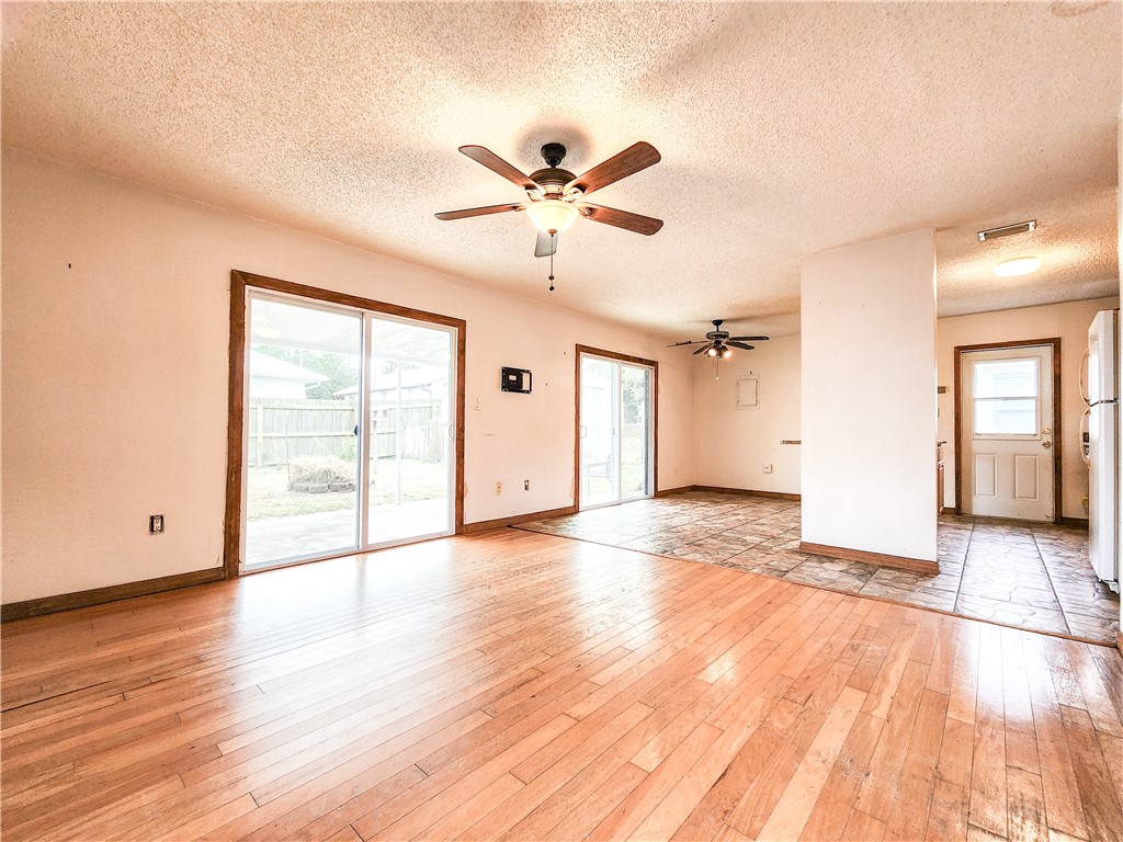 233 13th Street Southwest Vero Beach, FL 32962 - Photo 5 of 20 a view of an empty room with window and wooden floor