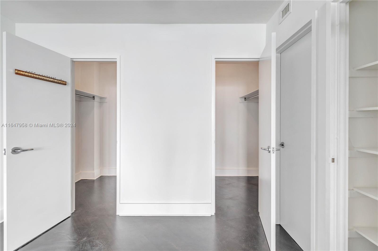 5151 Collins Avenue, Unit 1627 Miami Beach, FL 33140 - Photo 26 of 28 a view of a hallway with wooden floor