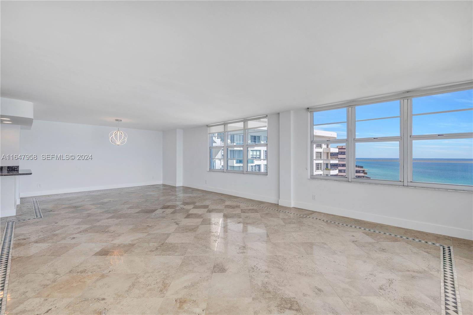 5151 Collins Avenue, Unit 1627 Miami Beach, FL 33140 - Photo 9 of 28 a view of an empty room and window
