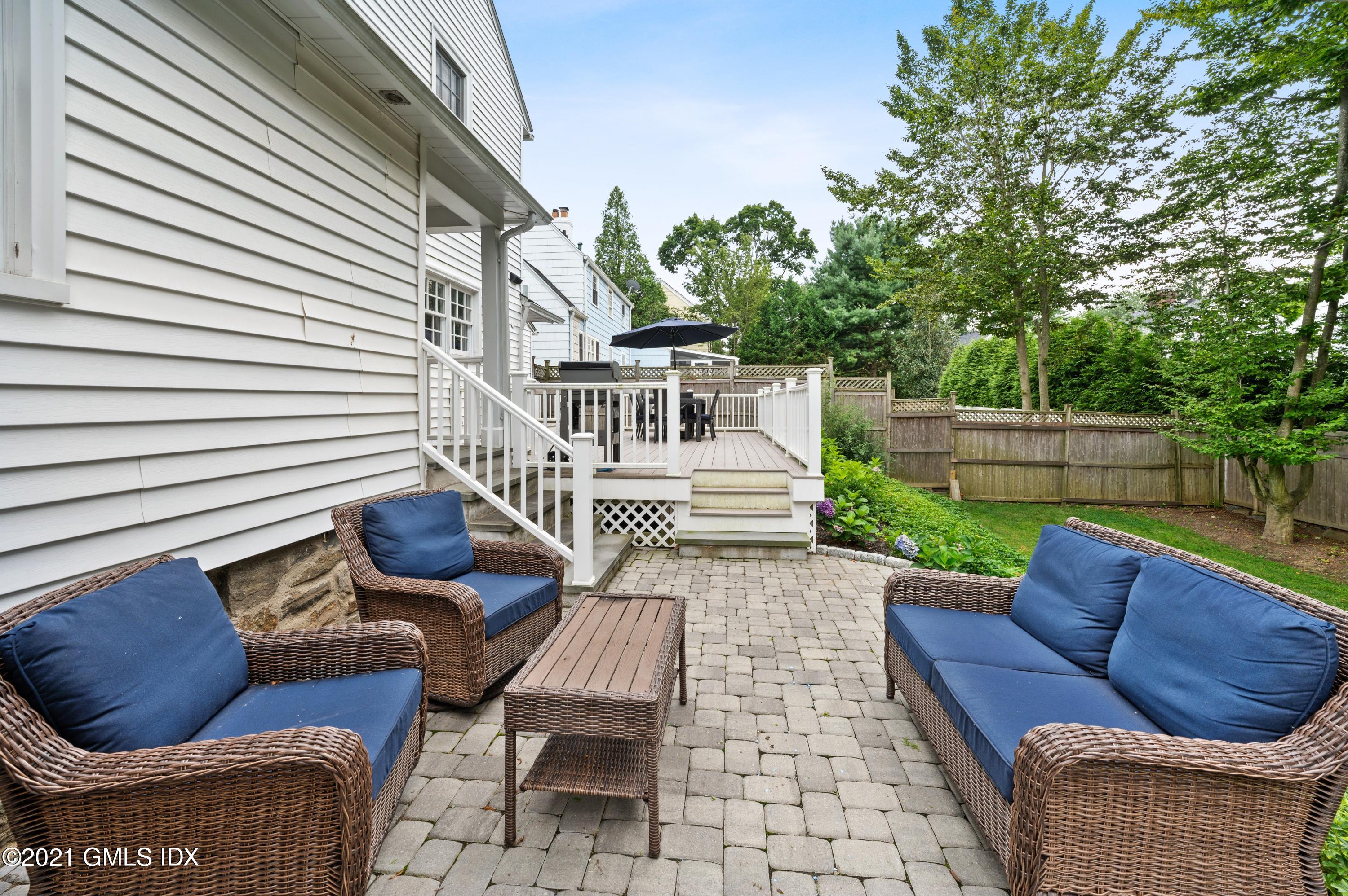 32 Perryridge Road Greenwich, CT 06830 - Photo 23 of 29 a view of a patio with couches chairs and a potted plant