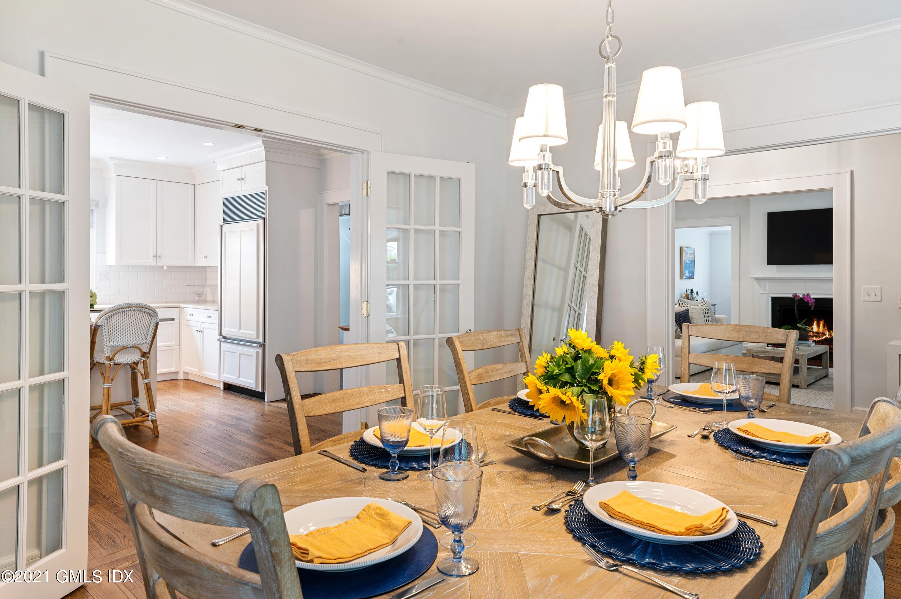 32 Perryridge Road Greenwich, CT 06830 - Photo 7 of 29 a dining room with furniture a rug and wooden floor