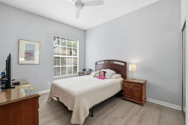 a bedroom with a bed and a desk