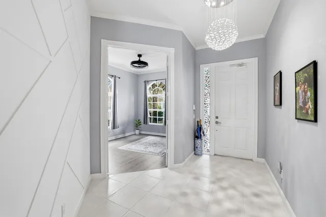 a view of a hallway with wooden shelves