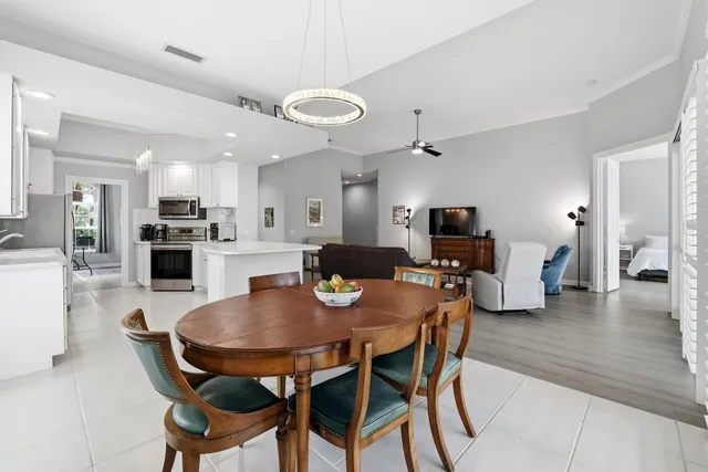 a dining room with furniture and wooden floor