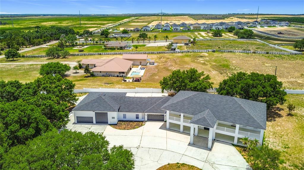 7925 Lake Mabel Loop Road Lake Wales, FL 33898 - Photo 9 of 97 an aerial view of residential houses with outdoor space and ocean view