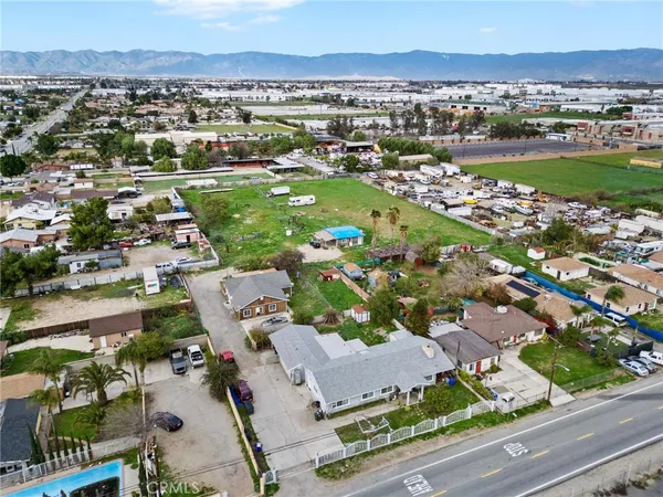 an aerial view of residential houses with outdoor space