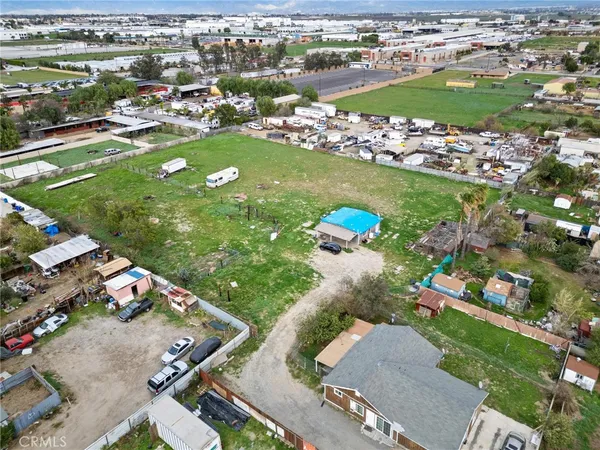 an aerial view of a residential houses with outdoor space