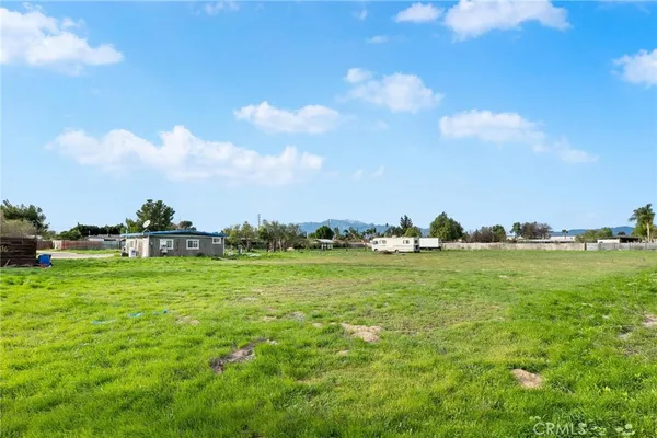 a view of a lake with houses in the back