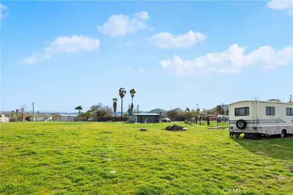 a view of yard with an house and outdoor seating