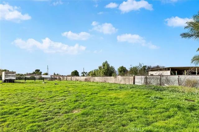 a backyard of a house with lots of green space