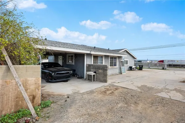a house view with a sitting space and wooden fence