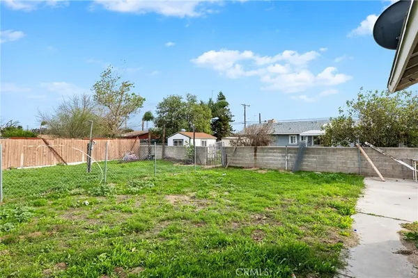 a view of a car park in front of a house