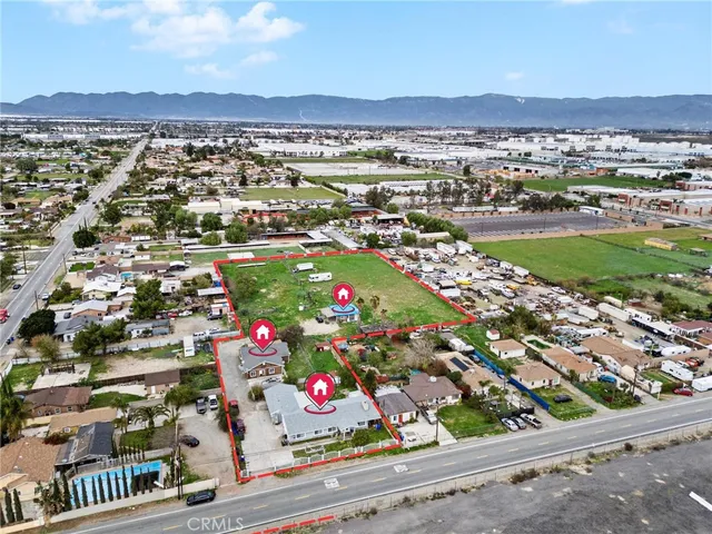 an aerial view of residential houses with outdoor space