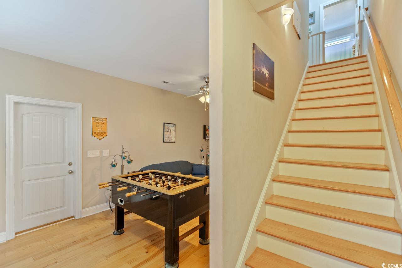3887 Spanner Way Murrells Inlet, SC 29576 - Photo 21 of 32 Staircase featuring wood finished floors and a ceiling fan