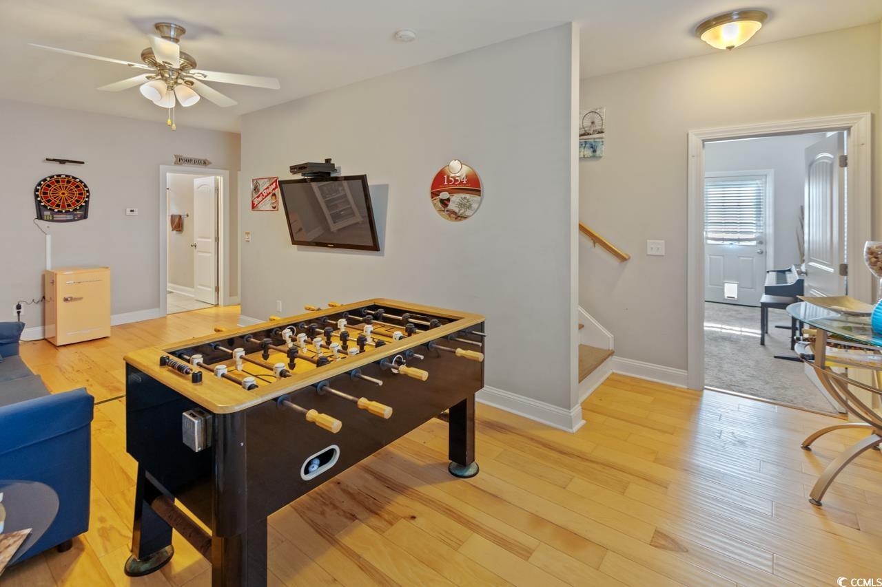 3887 Spanner Way Murrells Inlet, SC 29576 - Photo 23 of 32 Recreation room with light wood-style flooring and ceiling fan