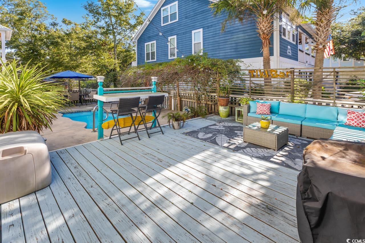 3887 Spanner Way Murrells Inlet, SC 29576 - Photo 30 of 32 Wooden terrace featuring a fenced backyard, an outdoor living space, and outdoor dining area