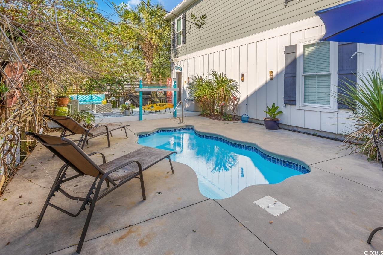 3887 Spanner Way Murrells Inlet, SC 29576 - Photo 32 of 32 Outdoor pool featuring a patio area