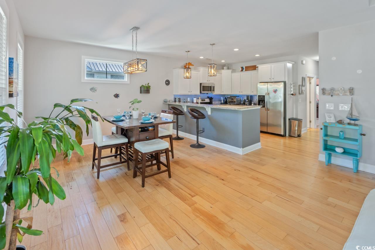 3887 Spanner Way Murrells Inlet, SC 29576 - Photo 7 of 32 Dining room with light wood-style floors and recessed lighting
