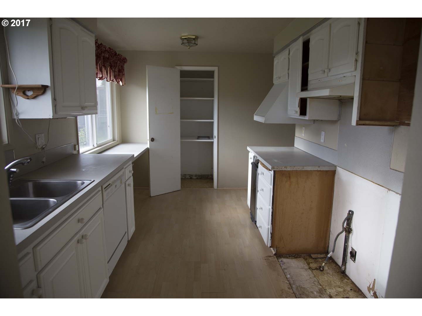20835 Butteville Road Northeast Donald, OR 97020 - Photo 4 of 14 a kitchen with stainless steel appliances granite countertop a sink a stove and a refrigerator with wooden floor