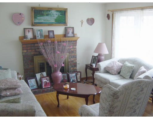 12 Bagley Road Holbrook, MA 02343 - Photo 5 of 6 a living room with furniture and a fireplace