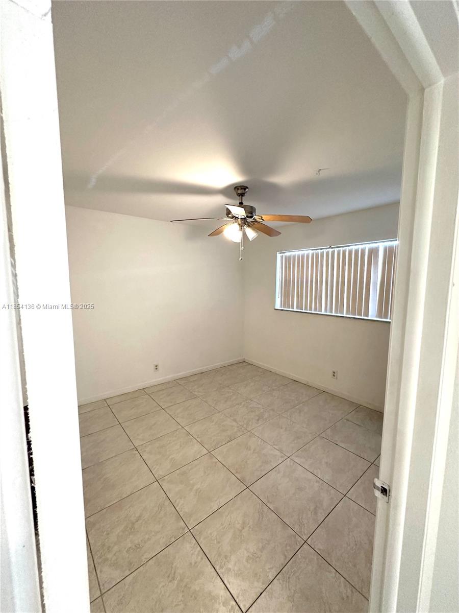 603 South State Road 7, Unit 1D Margate, FL 33068 - Photo 9 of 12 a view of an empty room and a window