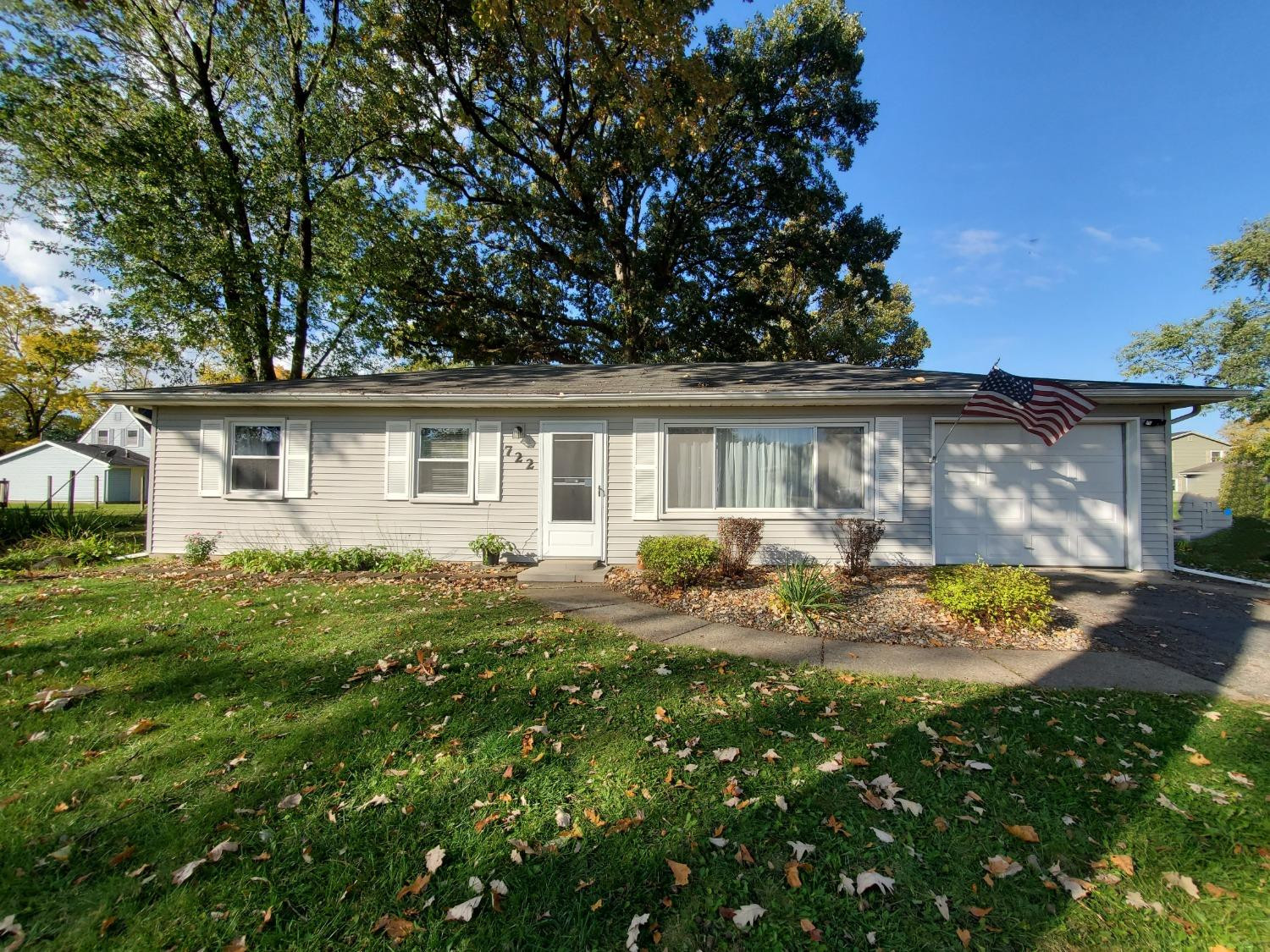 a view of a house with backyard sitting area and garden