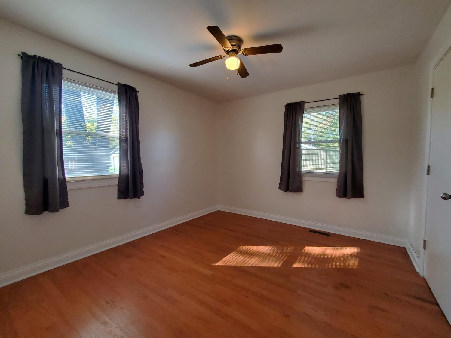 722 Fremont Road Valparaiso, IN 46385 - Photo 11 of 17 a view of an empty room with window and hardwood floor