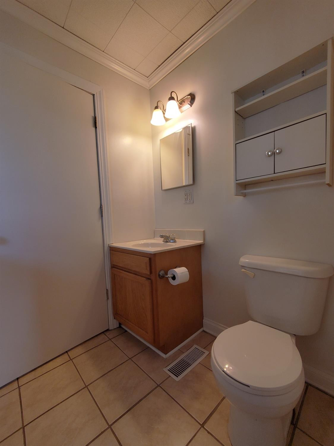 722 Fremont Road Valparaiso, IN 46385 - Photo 15 of 17 a bathroom with a granite countertop toilet and sink