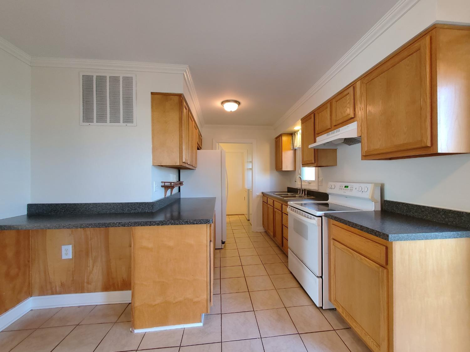 722 Fremont Road Valparaiso, IN 46385 - Photo 6 of 17 a kitchen with stainless steel appliances granite countertop a sink counter space and cabinets