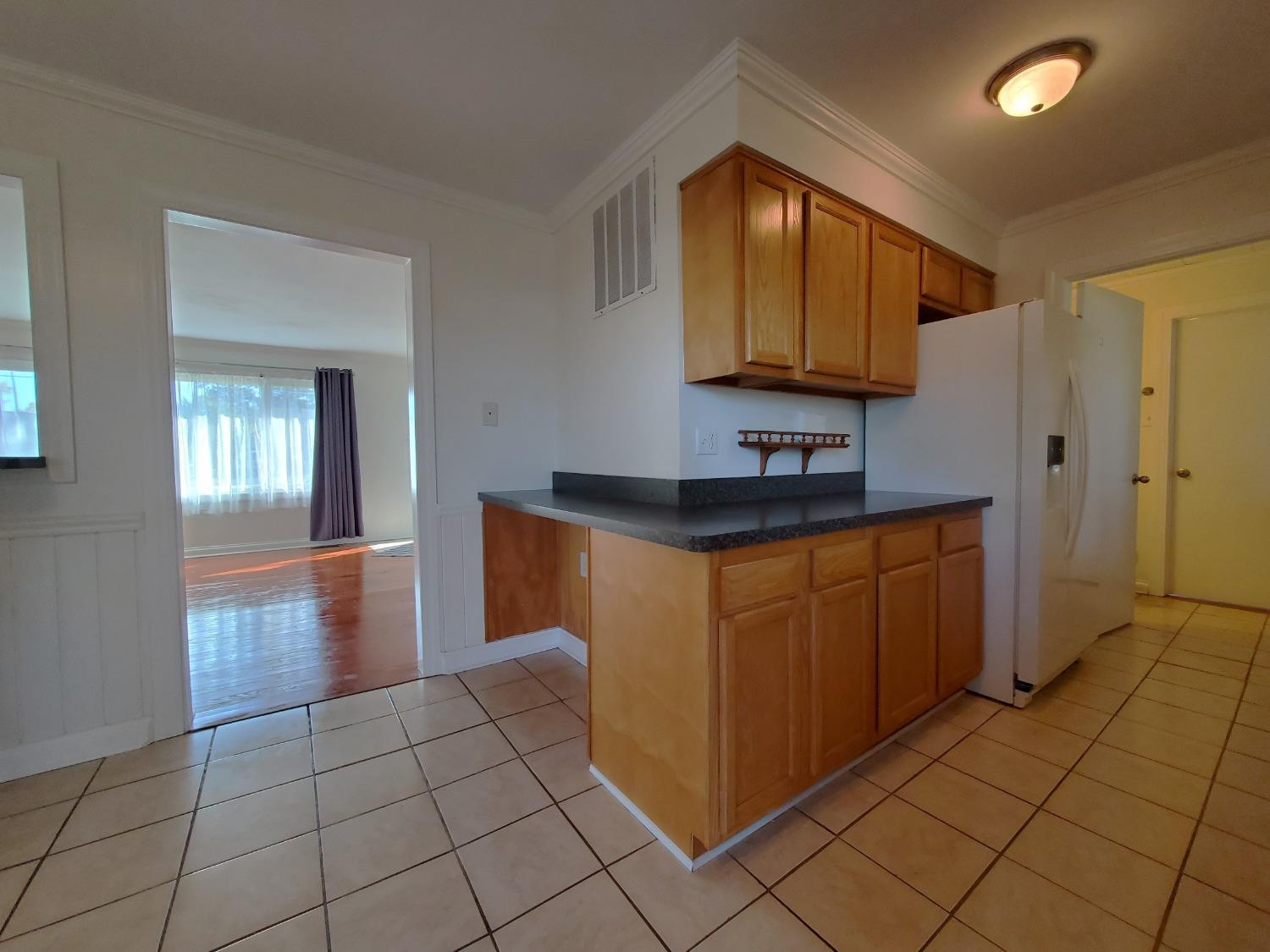 722 Fremont Road Valparaiso, IN 46385 - Photo 7 of 17 a kitchen with a sink and a mirror