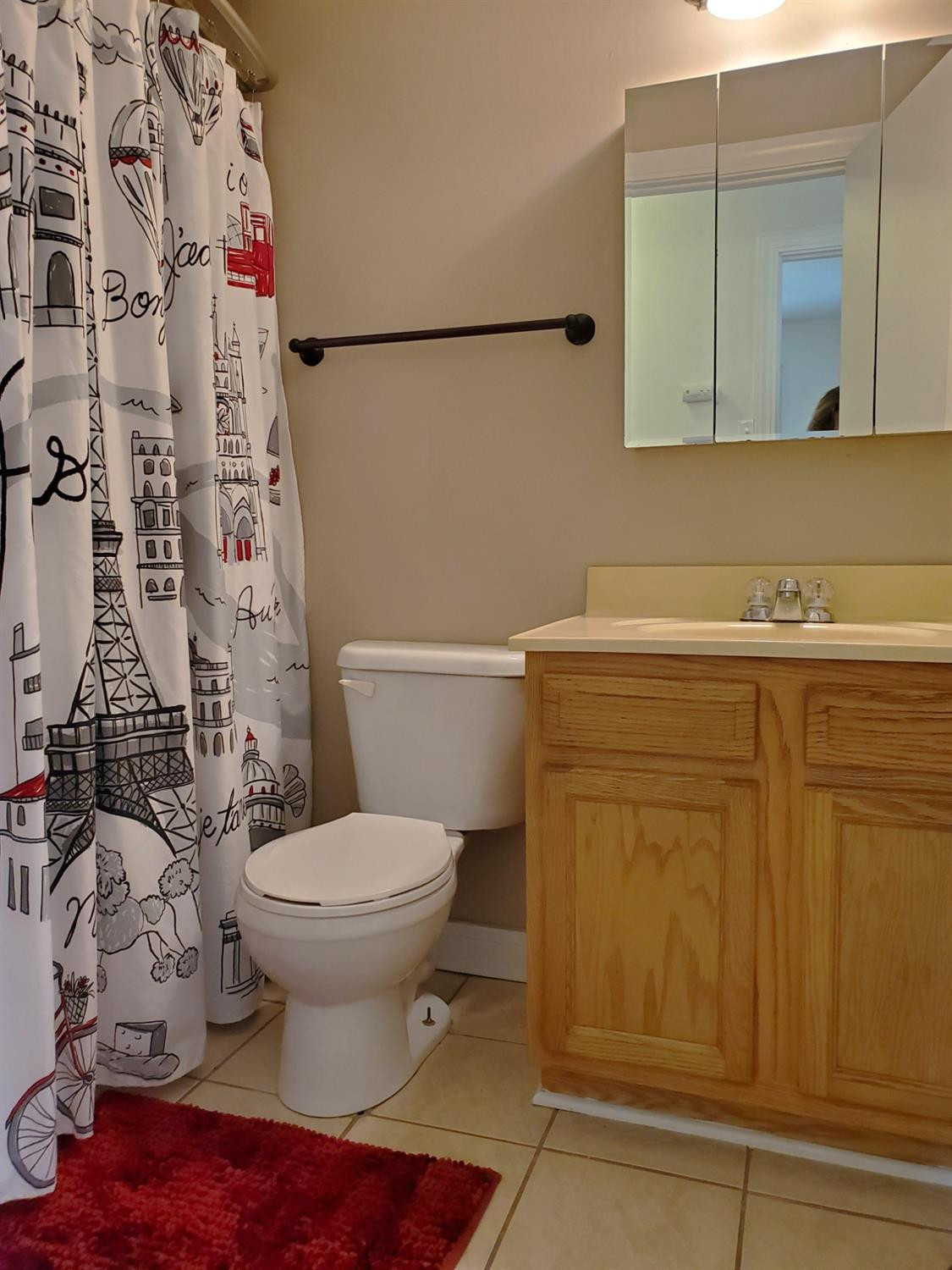 722 Fremont Road Valparaiso, IN 46385 - Photo 9 of 17 a bathroom with a toilet sink and mirror