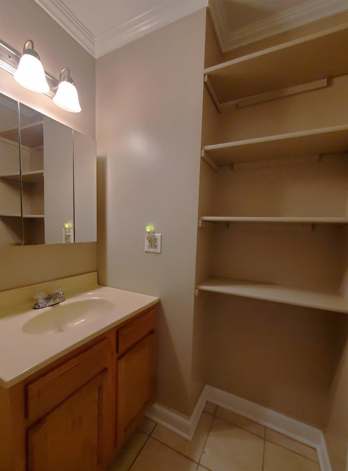 722 Fremont Road Valparaiso, IN 46385 - Photo 10 of 17 a bathroom with a sink and a mirror