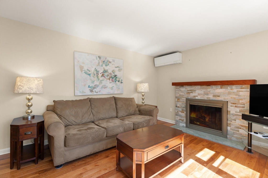552 Hudson Road Sudbury, MA 01776 - Photo 3 of 19 a living room with furniture and a fireplace