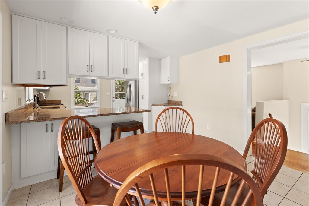552 Hudson Road Sudbury, MA 01776 - Photo 8 of 19 a view of a dining room with furniture and chandelier