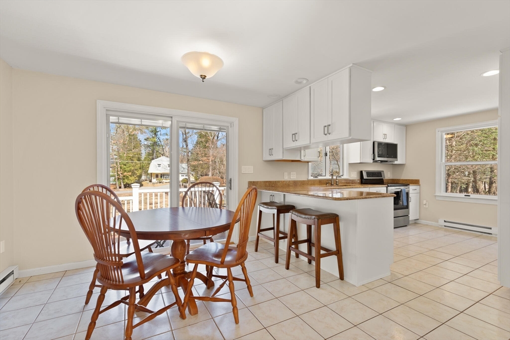 552 Hudson Road Sudbury, MA 01776 - Photo 9 of 19 a dining room with furniture and window
