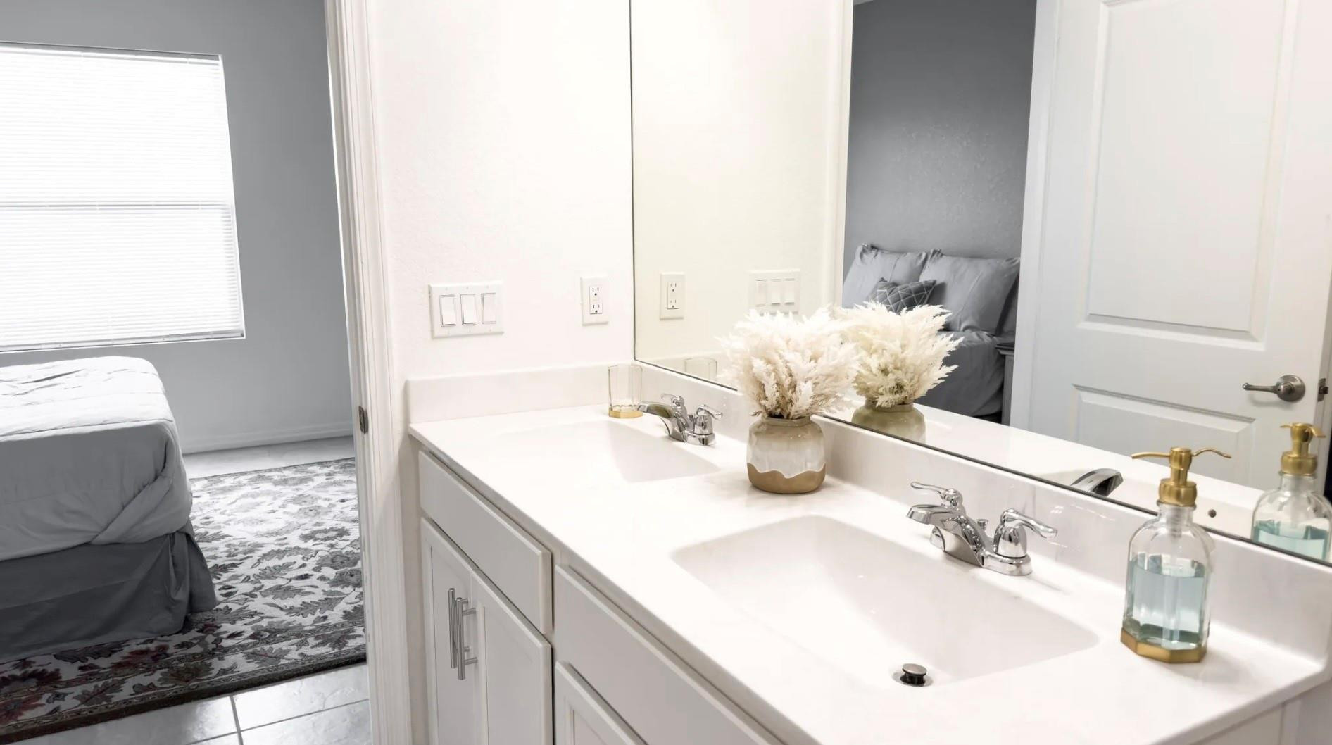 5114 Armina Place Fort Pierce, FL 34951 - Photo 20 of 28 a bathroom with a sink and a mirror