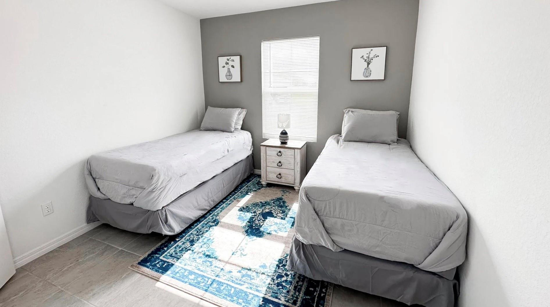 5114 Armina Place Fort Pierce, FL 34951 - Photo 6 of 28 a bed room with two beds and a chair