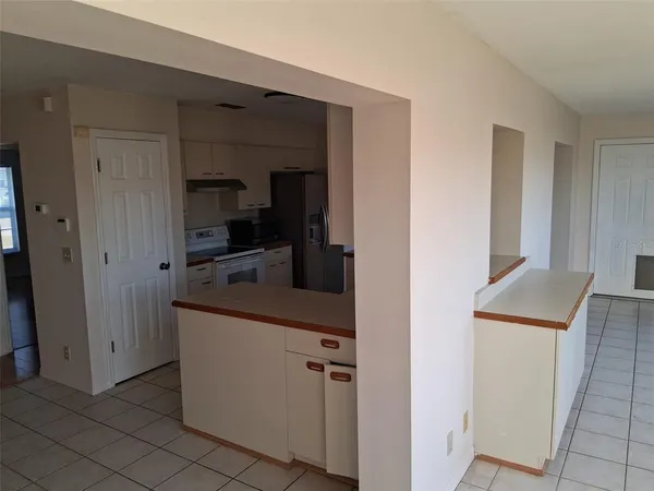 a kitchen with stainless steel appliances a refrigerator sink and cabinets