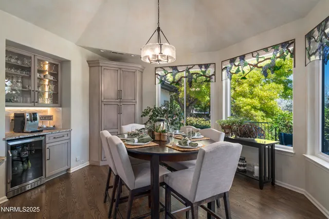 a view of a dining room with furniture window and outside view