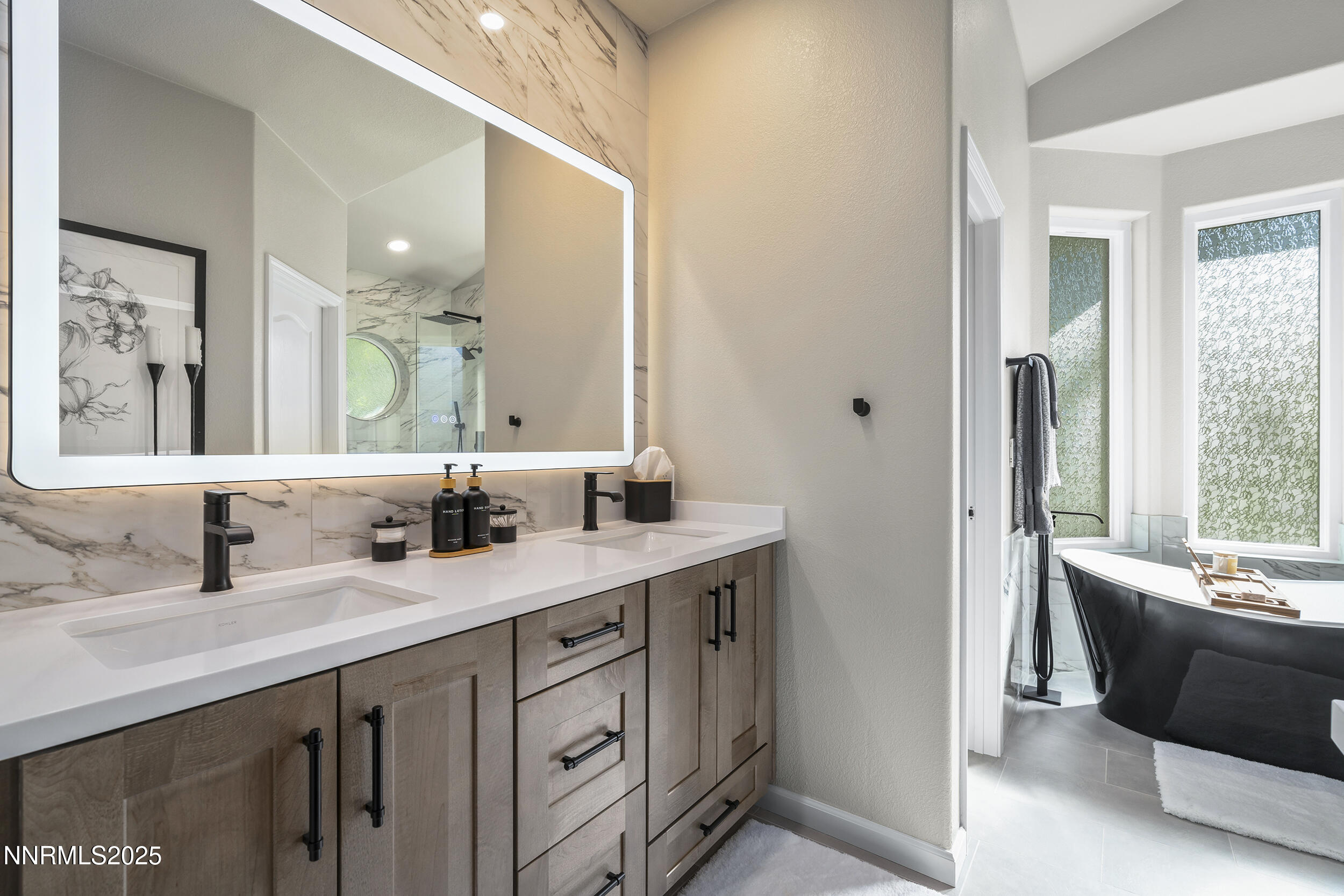 1762 Belford Road Reno, NV 89509 - Photo 17 of 70 a bathroom with a double vanity sink and a mirror