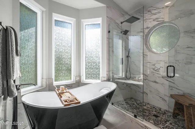 a living room with lots of furniture and kitchen view