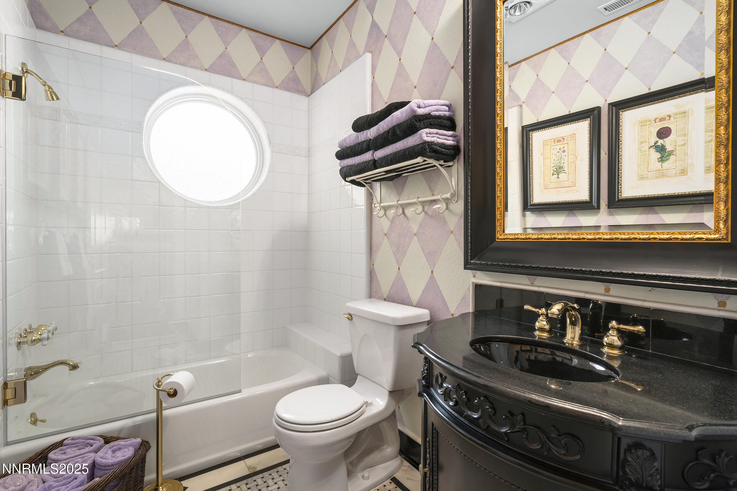 1762 Belford Road Reno, NV 89509 - Photo 19 of 70 a bathroom with a sink a toilet and a mirror