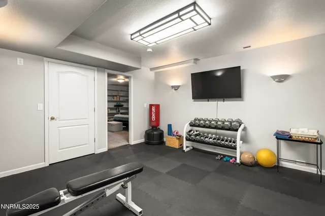 a view of a porch with furniture and a yard
