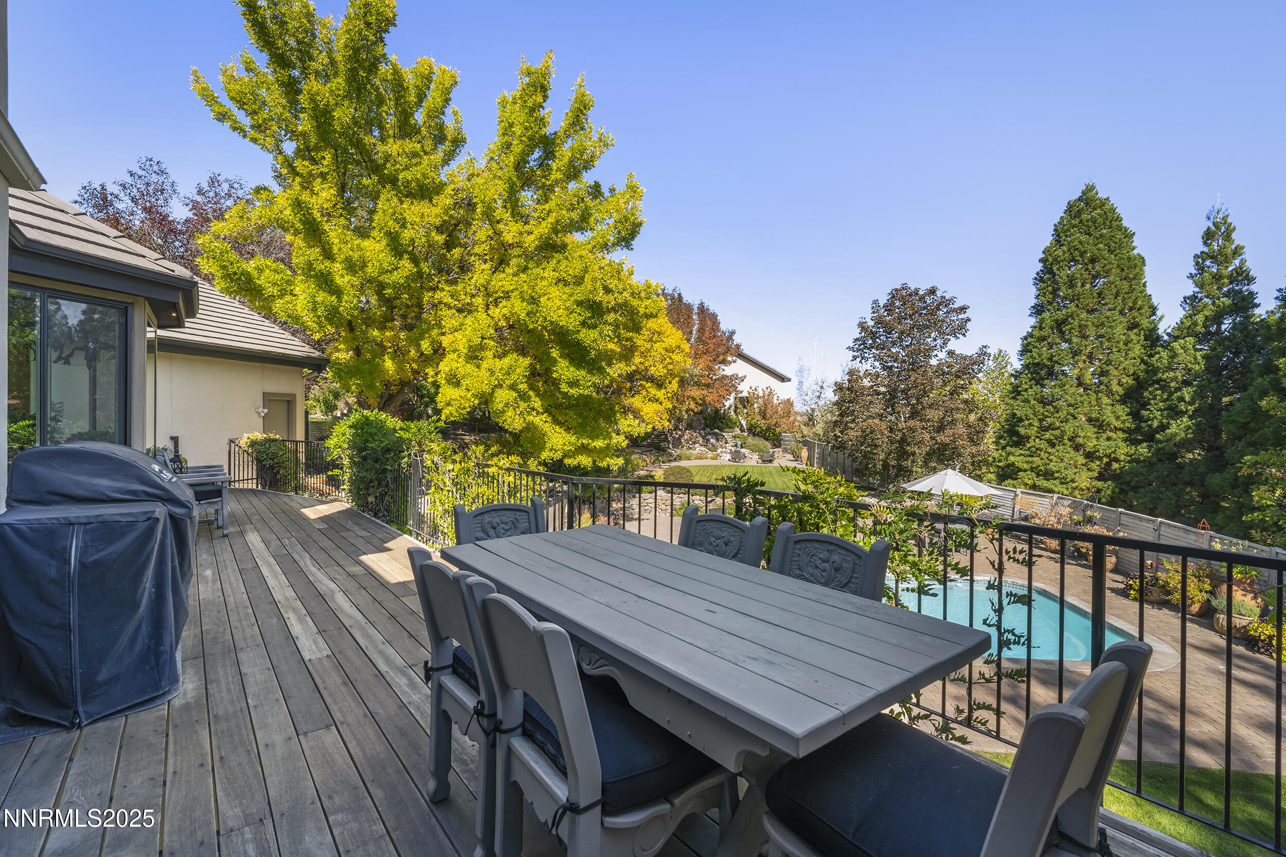1762 Belford Road Reno, NV 89509 - Photo 35 of 70 a view of a patio with table and chairs with wooden floor and fence