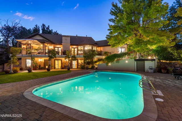 a view of a house with a yard and garage