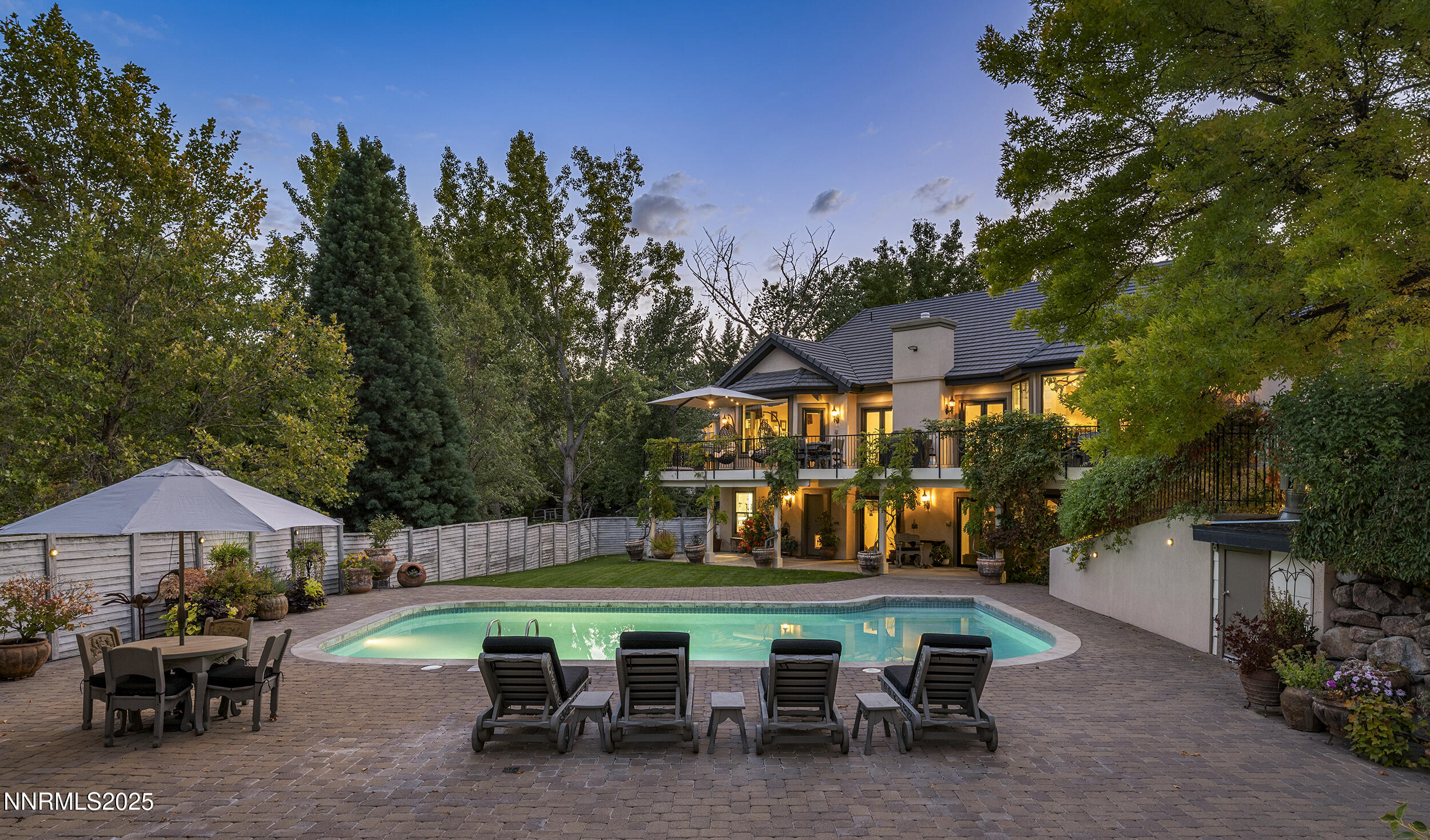 1762 Belford Road Reno, NV 89509 - Photo 44 of 70 a view of a patio with table and chairs under an umbrella