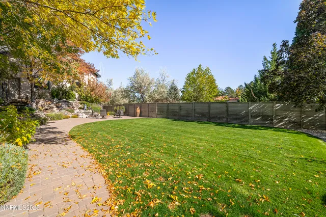 an aerial view of a house with a lake view